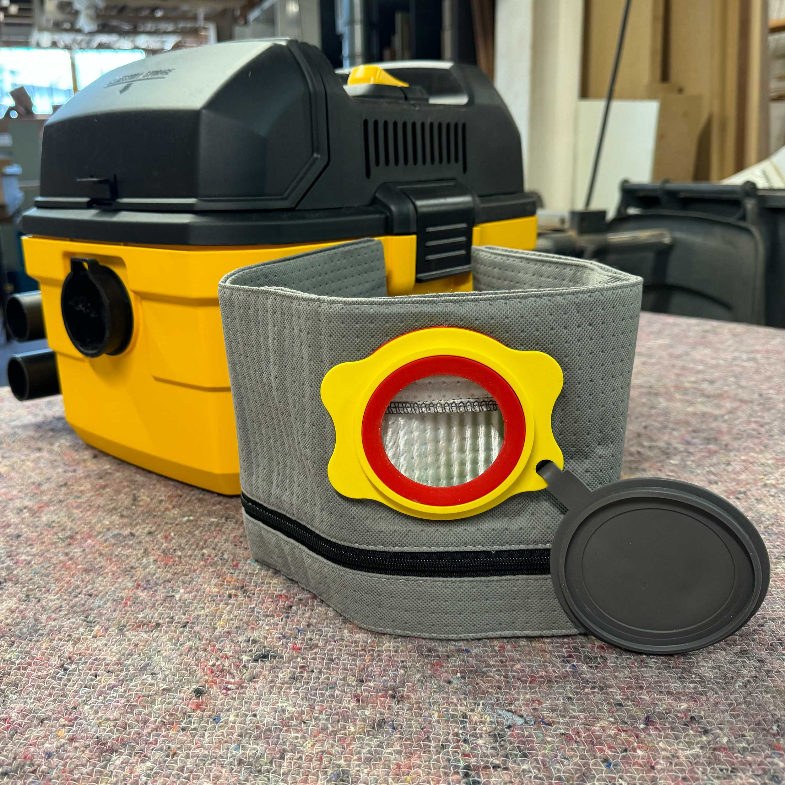 Close-up of the reusable dust bag fabric and collar for DeWalt DXV04T/DXV15T